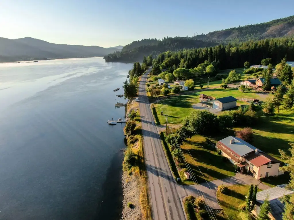Road, residential real estate, and undeveloped land next to a lake in Sandpoint, Idaho